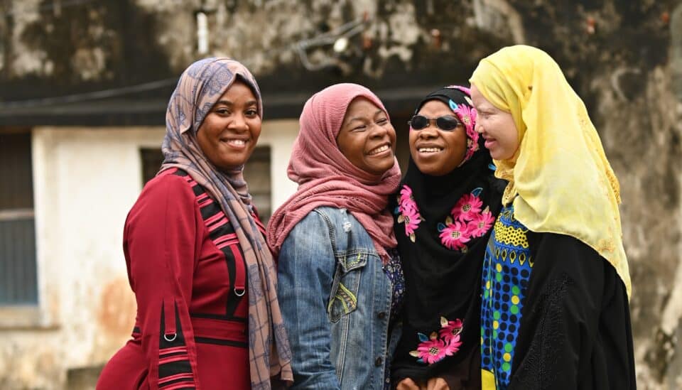 Zakia (personal assistant), PhatCat, Jamila, and Yumna, disability justice activists, Tanzania.